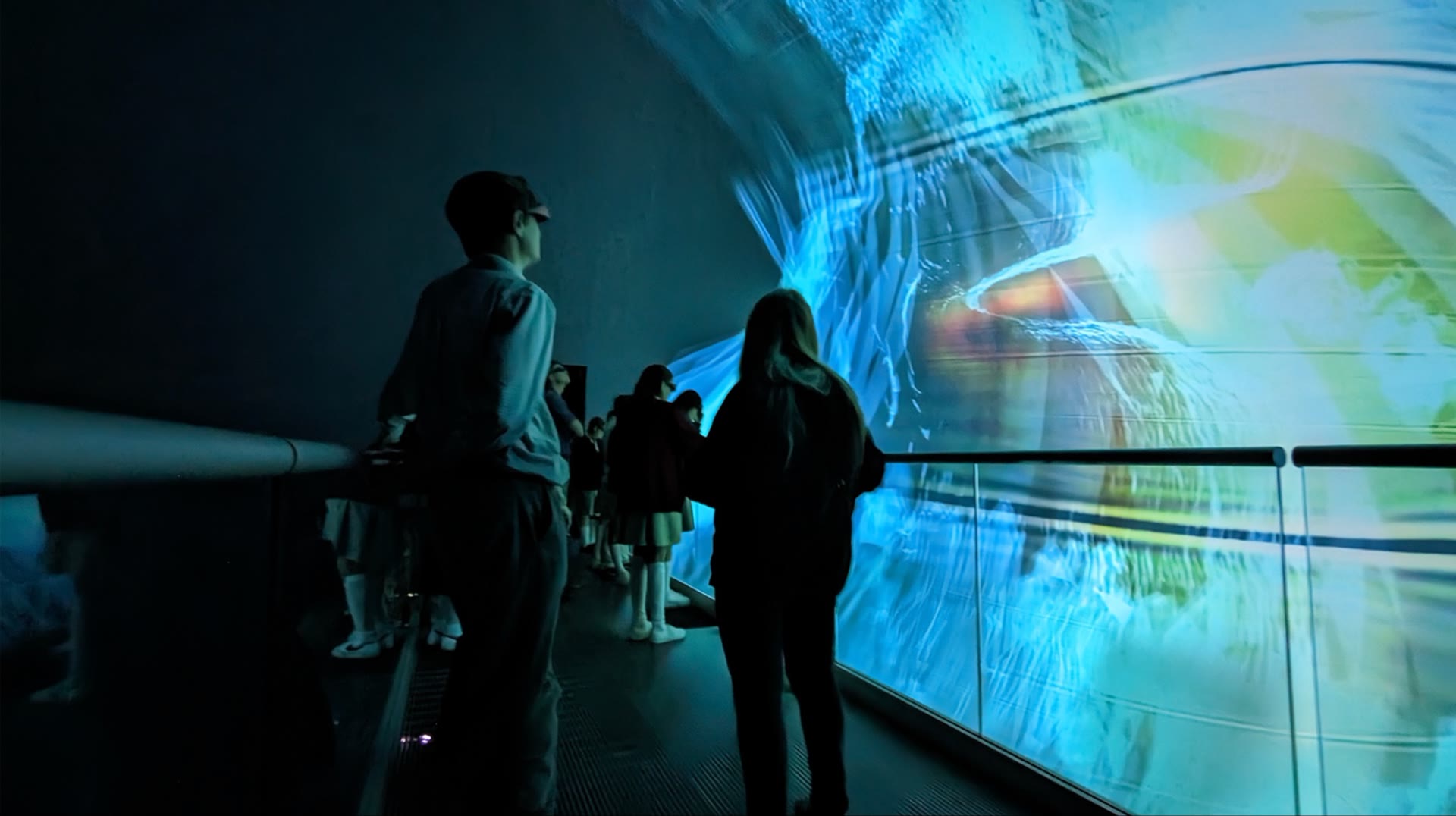 Researchers standing on the bridge inside the AlloSphere instrument
